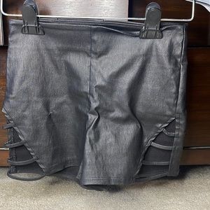 Leather black shorts with openings on the thighs